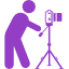 photographer-standing-behind-photo-camera-on-a-tripod-from-side-view